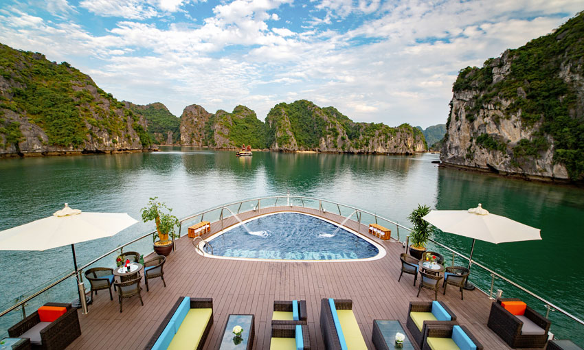 Enjoy the majestic view from sundeck of a Halong Bay Cruise Deals