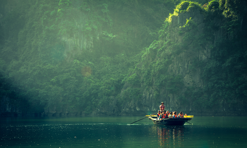Explore caves in Lan Ha Bay by bamboo boat