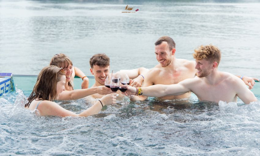 Young tourists having fun on Halong Bay cruise
